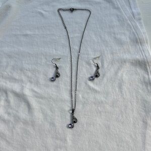 Nashville jewelry black necklace and purple gem stones with earrings to match